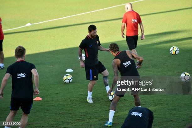 Barcelona players Lionel Messi , Neymar and teammates take part in a training session at Barry University in Miami, Florida, on July 27 two days...
