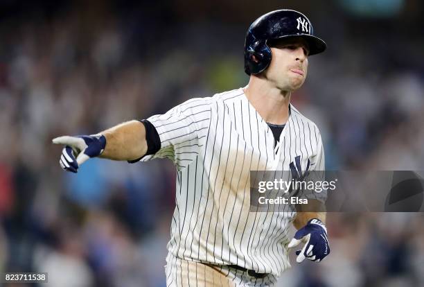 Brett Gardner of the New York Yankees celebrates his solo home run in the 11th inning against the Tampa Bay Rays on July 27, 2017 at Yankee Stadium...
