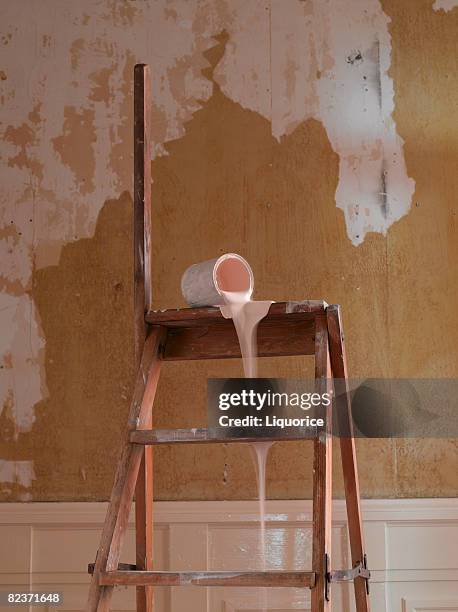 paint dripping down ladder - verschütten stock-fotos und bilder