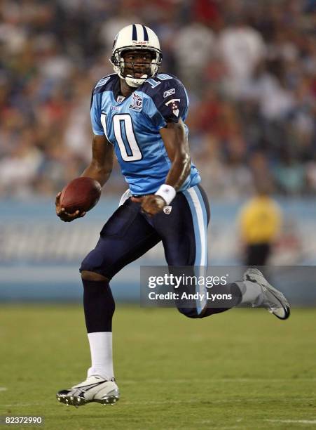 Vince Young of the Tennessee Titans runs with the ball during the NFL pre-season game against the Oakland Raiders at LP Field August 15, 2008 in...