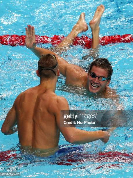 S Caeleb Remel Dressel celebrates with USA's Nathan Adrian after winning the men's 100m freestyle final during the swimming competition at the 2017...
