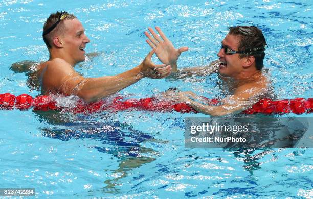 S Caeleb Remel Dressel celebrates with USA's Nathan Adrian after winning the men's 100m freestyle final during the swimming competition at the 2017...