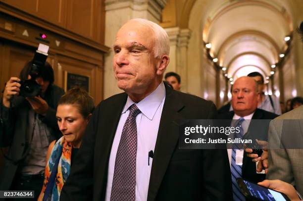 Sen. John McCain leaves the the Senate chamber at the U.S. Capitol after voting on the GOP 'Skinny Repeal' health care bill on July 28, 2017 in...