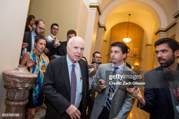 Sen John McCain leaves the Senate Chamber after a vote on a stripped-down, or 'Skinny Repeal,' version of Obamacare reform on July 28, 2017 in...