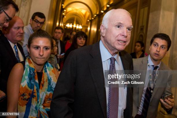 Sen John McCain leaves the Senate Chamber after a vote on a stripped-down, or 'Skinny Repeal,' version of Obamacare reform on July 28, 2017 in...