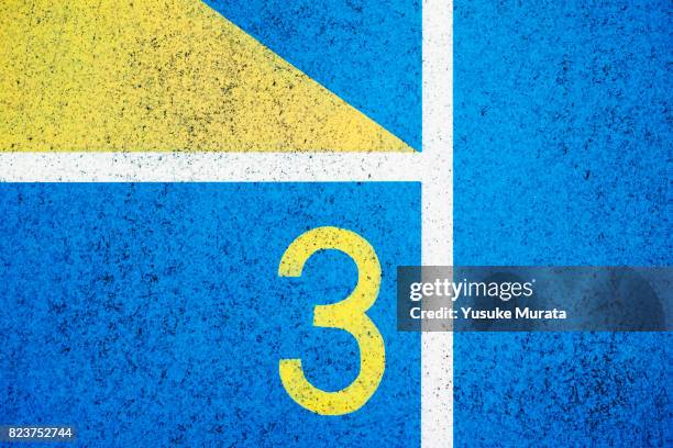 numbers on running track - third stock pictures, royalty-free photos & images