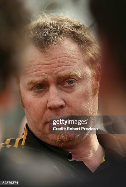 Coach of the Tigers Simon Atkins talks to his players during the round 18 VFL match between the Werribee Tigers and the Box Hill Hawks at Bartercard...