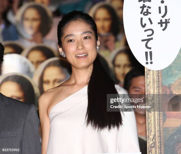 Actress Eriko Hatsune greets fans on stage at premiere of film 'Bannou kanteishi Q: Mona Riza no hitomi' on May 31, 2014 in Tokyo, Japan.