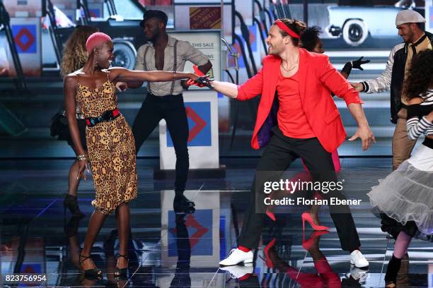 Aminata Sanogo and Marc Eggers perform on stage during the 1st show of the television competition 'Dance Dance Dance' on July 12, 2017 in Cologne,...