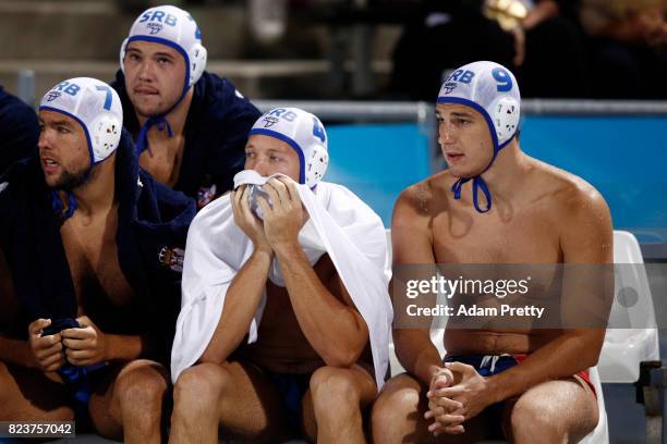 The Serbian team look on from the bench during the Mens Waterpolo Semi-final match against Croatia on day fourteen of the Budapest 2017 FINA World...