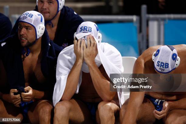 The Serbian team look on from the bench during the Mens Waterpolo Semi-final match against Croatia on day fourteen of the Budapest 2017 FINA World...