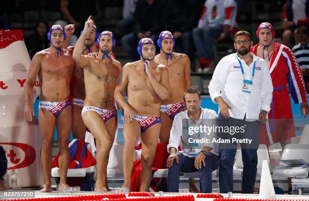 The Croatian team shout instructions from the bench during the Mens Waterpolo Semi-final match against Serbia on day fourteen of the Budapest 2017...