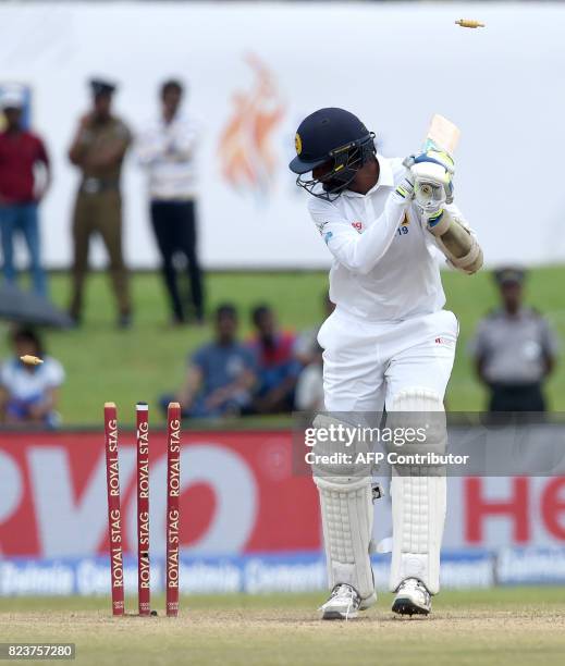 Sri Lankan batsman Nuwan Pradeep is dismissed by Indian bowler Hardik Pandya during the third day of the first Test match between Sri Lanka and India...