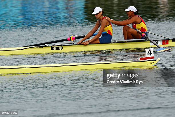 Georgeta Andrunache and Viorica Susanu of Romania celebrate the gold medal in the Women's Pair Final at the Shunyi Olympic Rowing-Canoeing Park on...