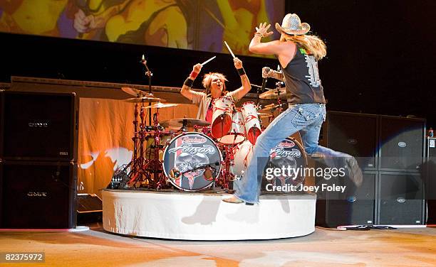 Rikki Rockett and Bret Michaels of Poison performs live in concert at the Verizon Wireless Music Center on August 15, 2008 in Noblesville,Indiana.