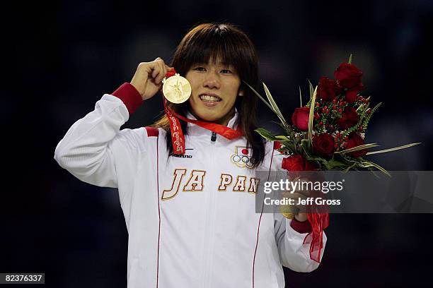 Saori Yoshida of Japan poses with her gold medal after defeating Xu Li of China in the women's 55kg freestyle wrestling event held at the China...