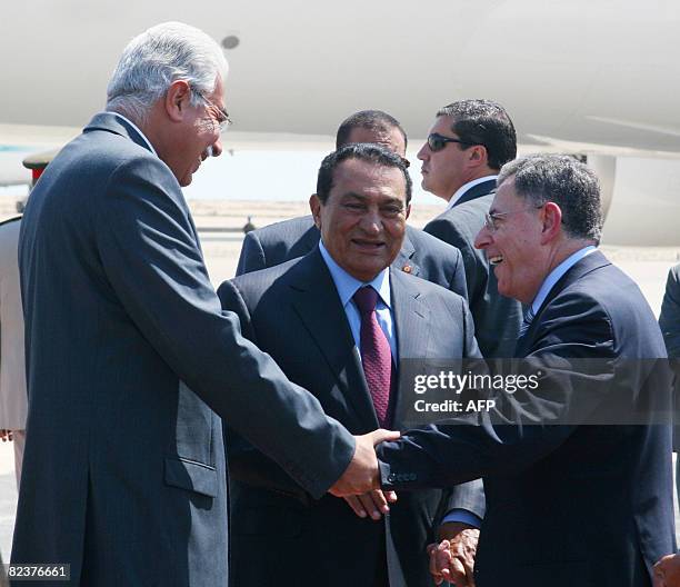 Egyptian President Hosni Mubarak and Prime Minister Ahmad Nazif talk to Lebanese Premier Fuad Siniora at the Burg al-Arab airport outside the...