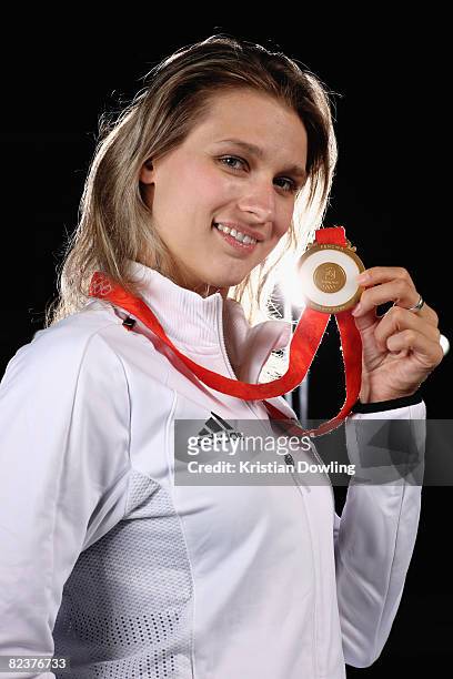 Fencing gold medalist Britta Heidemann poses with her medal during a portrait session at the fencing training hall on August 16, 2008 in Beijing,...