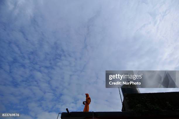 Nepalese youth from Hindu school Bhagwat Sanyaas Aashram Gurukul prepare for rituals offering during Nag Panchami festival at Pashupatinath Temple,...