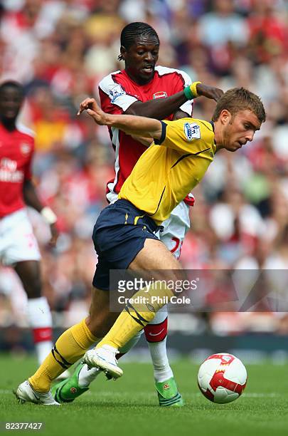 James Morrison of West Bromwich Albion battles for the ball with Emmanuel Adebayor of Arsenal during the Barclays Premier League match between...