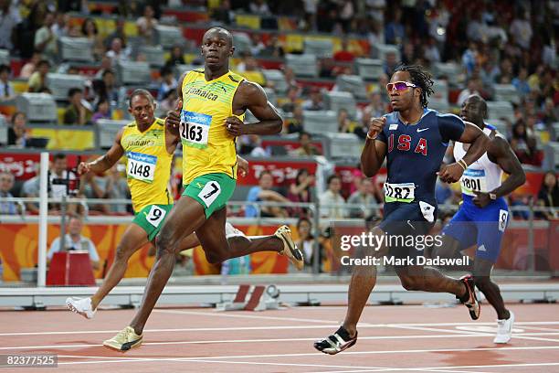 Michael Frater of Jamaica, Usain Bolt of Jamaica, Walter Dix of the United States and Tyrone Edgar of Great Britain compete in the Men's 100m...