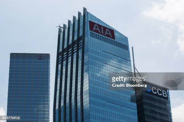 The AIA Central building, which houses the headquarters of AIA Group Ltd., center, stands between the Cheung Kong Center, left and the CCB Tower in...