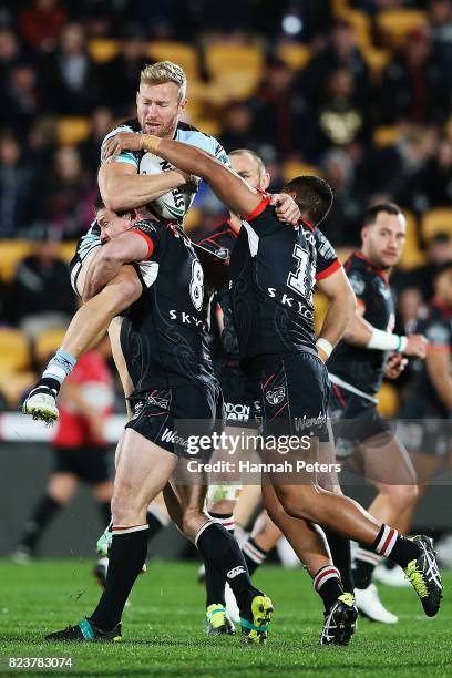 Matt Prior of the Sharks is lifted high in the tackle during the round 21 NRL match between the New Zealand Warriors and the Cronulla Sharks at Mt...