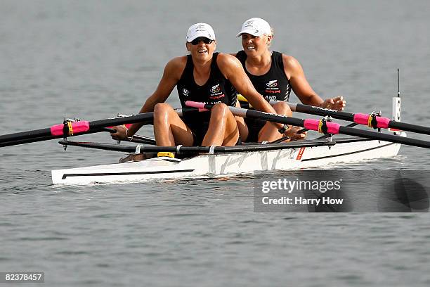 Caroline and Georgina Evers-Swindell of New Zealand look on after competing in Women's double sculls final competes in the rowing event at the Shunyi...