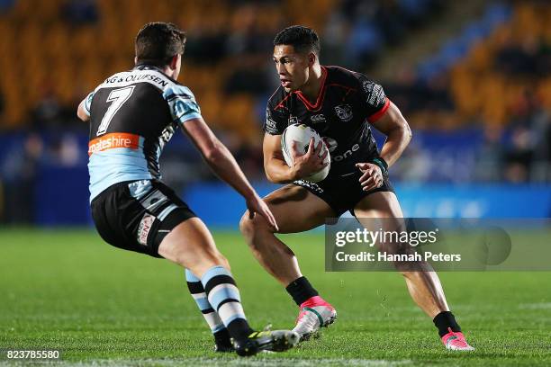 Roger Tuivasa-Sheck of the Warriors makes a break during the round 21 NRL match between the New Zealand Warriors and the Cronulla Sharks at Mt Smart...