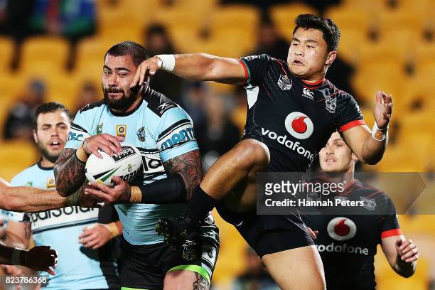 Andrew Fifita of the Sharks secures the high ball over Mason Lino of the Warriors during the round 21 NRL match between the New Zealand Warriors and...