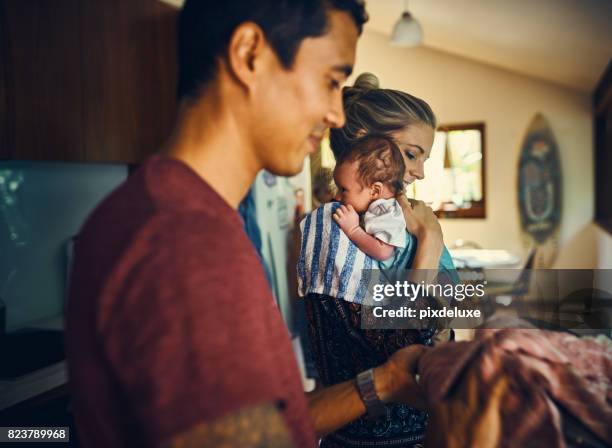 daily domesticities with their brand new baby boy - new kitchen stock pictures, royalty-free photos & images