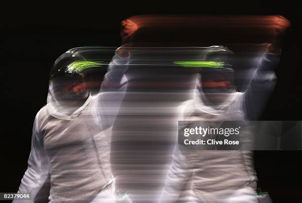 Competitor celebrates a point in the Women's Team Foil Gold Medal Match at the Fencing Hall on Day 8 of the Beijing 2008 Olympic Games on August 16,...