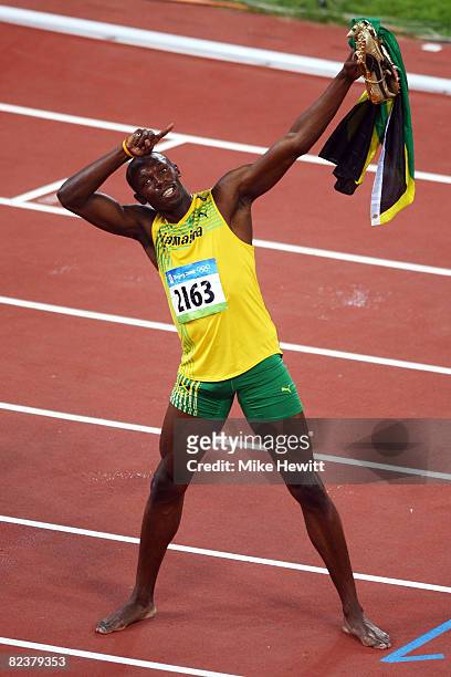 Usain Bolt of Jamaica celebrates winning the Men's 100m Final and the gold medal at the National Stadium on Day 8 of the Beijing 2008 Olympic Games...