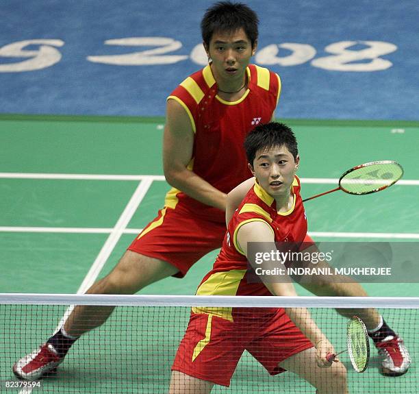 Yu Yang and He Hanbin of China play against Nova Widianto and Liliyana Natsir of Indonesia in the mixed doubles semi-final of the badminton event...