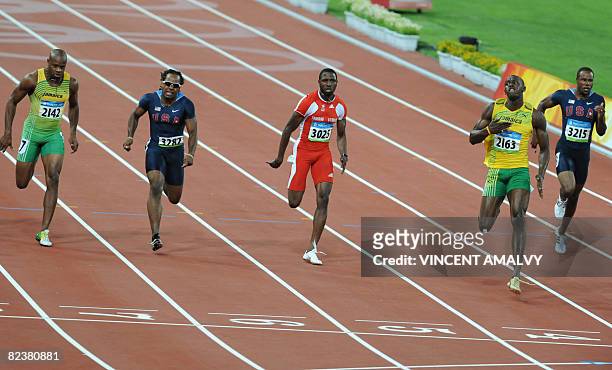 Jamaica's Usain Bolt wins the men's 100m final at the National stadium as part of the 2008 Beijing Olympic Games on August 16, 2008. AFP PHOTO /...