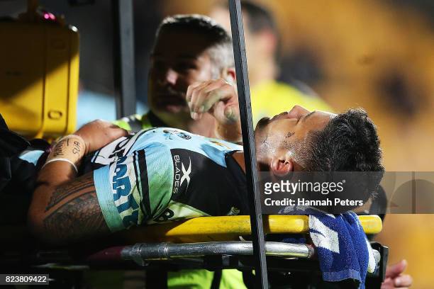 Fa'amanu Brown of the Sharks is taken off on a stretcher during the round 21 NRL match between the New Zealand Warriors and the Cronulla Sharks at Mt...