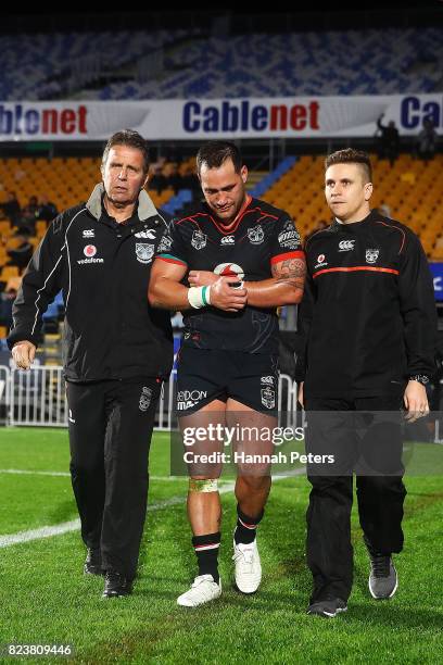 Bodene Thompson of the Warriors walks off injured during the round 21 NRL match between the New Zealand Warriors and the Cronulla Sharks at Mt Smart...