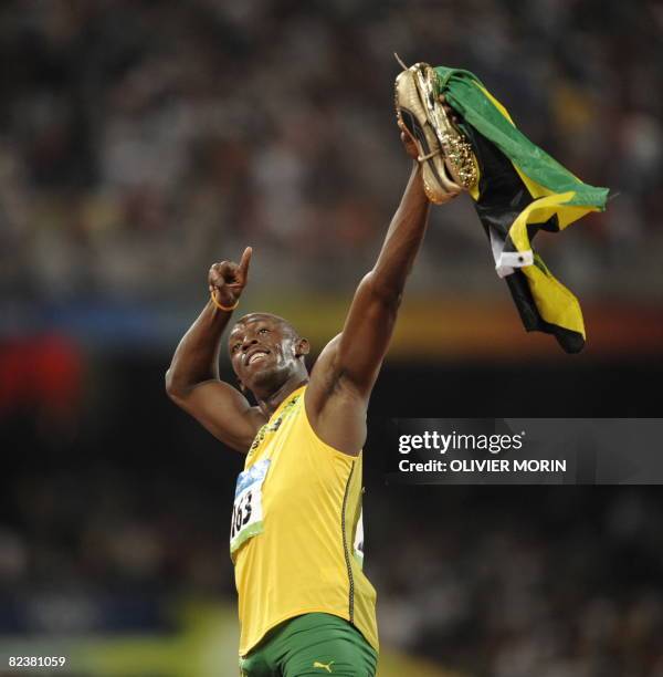 Jamaica's Usain Bolt celebrates after winning the men's 100m final at the "Bird's Nest" National Stadium as part of the 2008 Beijing Olympic Games on...