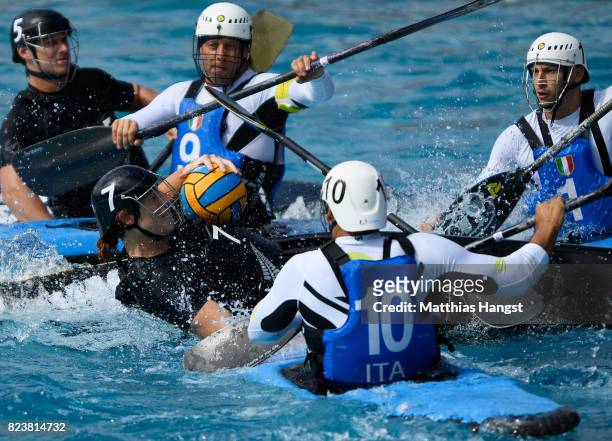 Sam Hapeta of New Zealand breaks through the defence of Italy during the Canoe Polo Men's match between Italy and New Zealand of The World Games at...