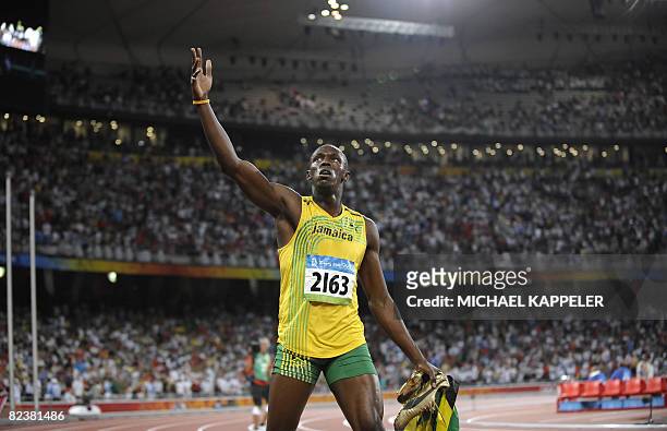 Jamaica's Usain Bolt celebrates after winning the men's 100m final at the National stadium as part of the 2008 Beijing Olympic Games on August 16,...