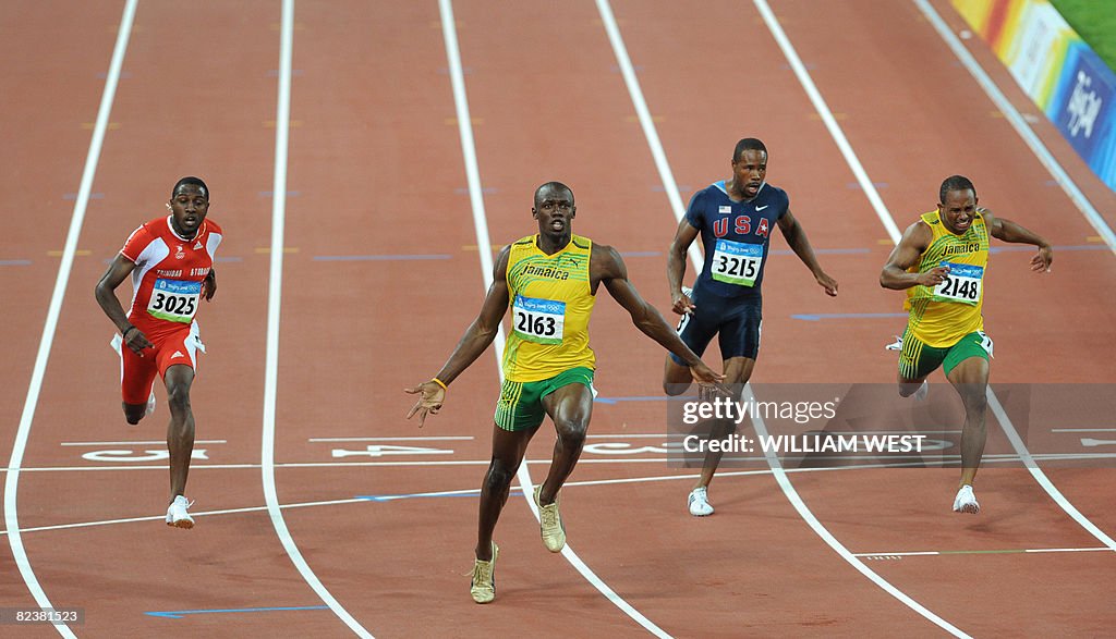 Jamaica's Usain Bolt (2ndL) celebrates a