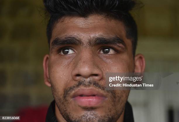 National Boxing Medallist and four-time state gold medallist Akshay Mare sweats after exercise at SP College Ground, on July 27, 2017 in Pune, India....