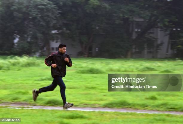 National Boxing Medallist and four-time state gold medallist Akshay Mare exercises at SP College Ground, on July 27, 2017 in Pune, India. Akshay...