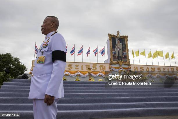 Thai palace guards stand at attention at the Royal palace during Merit-making ceremonies as Thai people celebrate the 65th birthday of His Majesty...