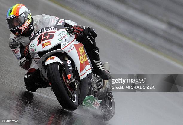 Alex De Angelis of San Marino rides his Honda during the qualifying practice session at the Czech Republic's Grand Prix in MotoGP on August 16, 2008...