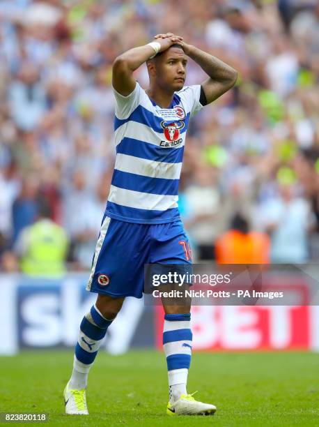 Reading's Liam Moore shows his dejection after missing his penalty in the penalty shoot out and defeat against Huddersfield Town during the Sky Bet...
