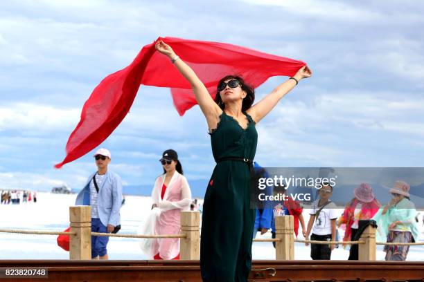 Woman poses for a photo around Chaka Salt Lake at Chaka Town on July 27, 2017 in Haixi Mongolian and Tibetan autonomous Prefecture, Qinghai Province...