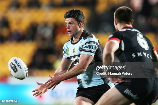 Chad Townsend of the Sharks passes the ball out during the round 21 NRL match between the New Zealand Warriors and the Cronulla Sharks at Mt Smart...