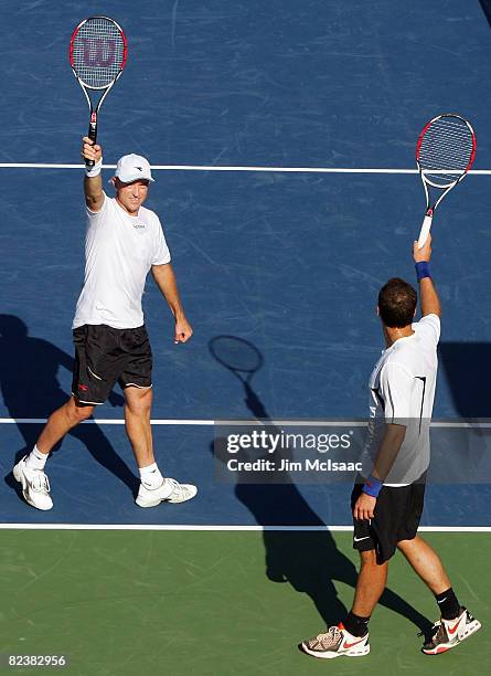 Bruno Soares of Brazil and Kevin Ullyett of Zimbabwe celebrate their victory against Marcel Granollers of Spain and Sebastien Prieto of Argentina...