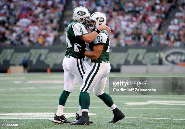 Brett Favre of the New York Jets celebrates with Dustin Keller after a touchdown in a pre-season NFL game against the Washington Redskins at Giants...